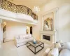 Tiled living room with french doors and a healthy amount of sunlight