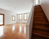 Staircase with hardwood / wood-style floors