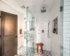 Bathroom with a shower with door