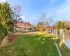 View of yard featuring a dock and a water view