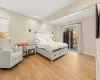 Bedroom with access to outside and light wood-type flooring