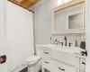 Full bathroom with vanity, toilet, and shower / bath combination with curtain