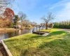 Dock area featuring a yard and a water view