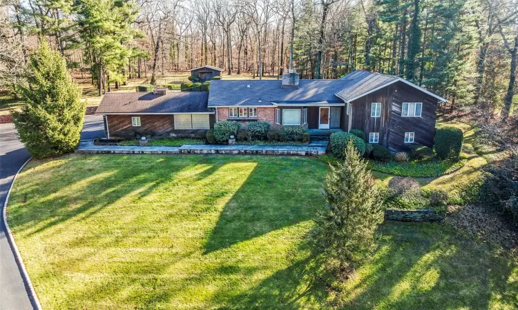 Ranch-style home featuring a front yard