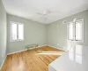 Spare room featuring ceiling fan and light wood-type flooring