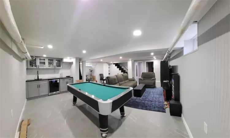 Recreation room with indoor bar, wine cooler, and billiards