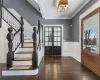 Front foyer with restored hardwood floors, oak banisters and railings.