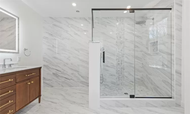 Primary bedroom walk-in closet with built-ins.