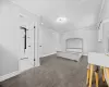 Kitchen with hanging light fixtures, appliances with stainless steel finishes, sink, a center island, and a skylight