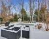 Snowy yard with an outbuilding