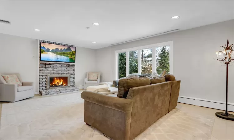 Stairs featuring a tile fireplace and tile patterned floors