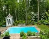 View of swimming pool with an outdoor structure