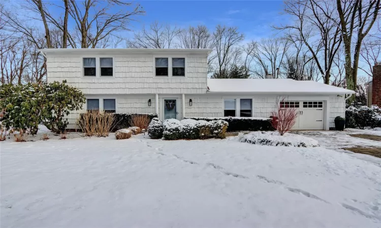 View of property featuring a garage