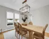 Dining space featuring baseboard heating and light wood-type flooring