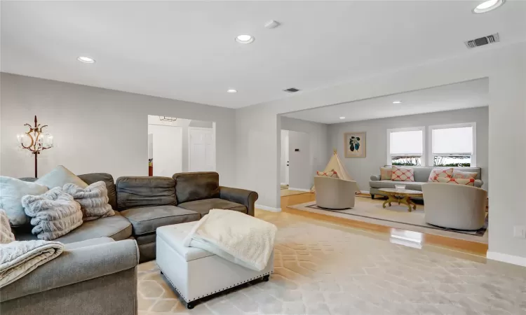 Living room featuring a brick fireplace