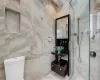 Bathroom featuring sink and walk in shower