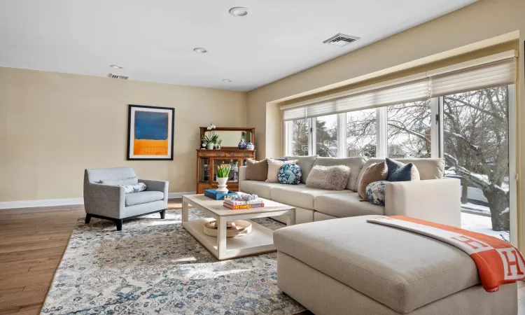 Living room with wood-type flooring