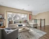 Living room featuring wood-type flooring and lofted ceiling