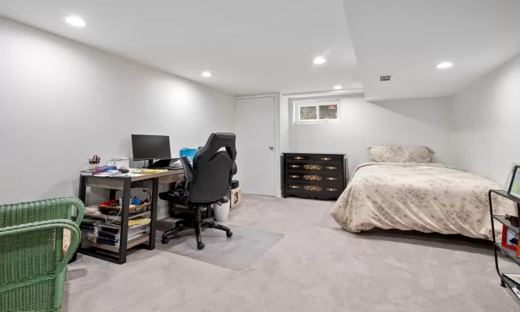 Bedroom with light carpet