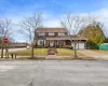 View of front facade with a garage and a front yard