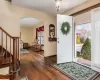 Foyer with dark wood-type flooring and a wealth of natural light