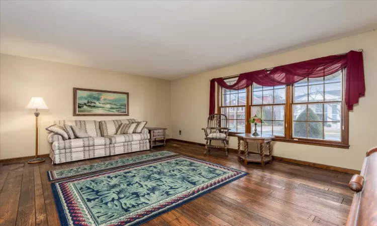 Living room with hardwood / wood-style flooring