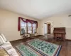 Living room with dark hardwood / wood-style flooring