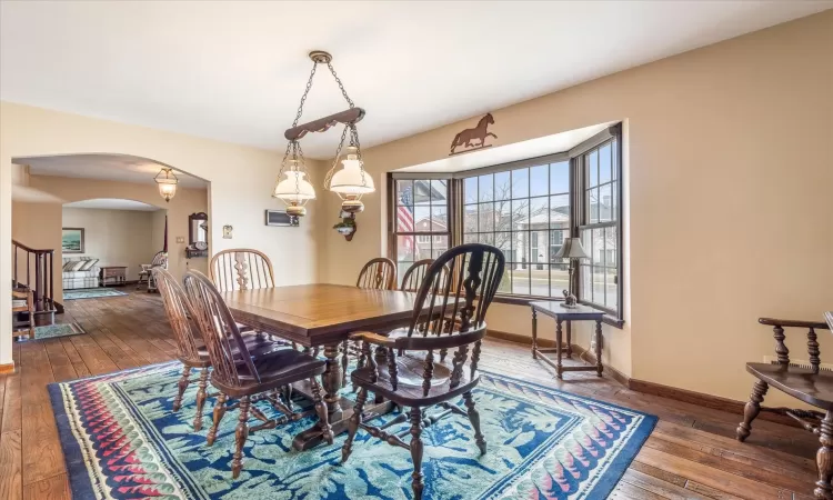 Dining room featuring dark wood-type flooring