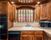 Kitchen with sink and black appliances