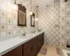 Bathroom featuring tile patterned floors and vanity