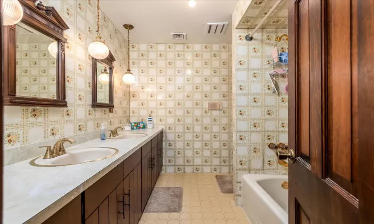 Bathroom with tub / shower combination and vanity