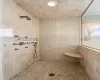 Bathroom with tiled shower