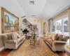 Living room featuring lofted ceiling and hardwood / wood-style floors