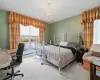 Bedroom featuring a chandelier and carpet flooring