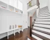 Mudroom with a high ceiling and dark hardwood / wood-style flooring