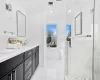 Bathroom with vanity, ornamental molding, and separate shower and tub