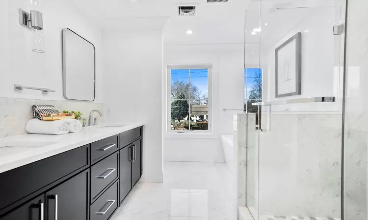 Bathroom with vanity, ornamental molding, and separate shower and tub