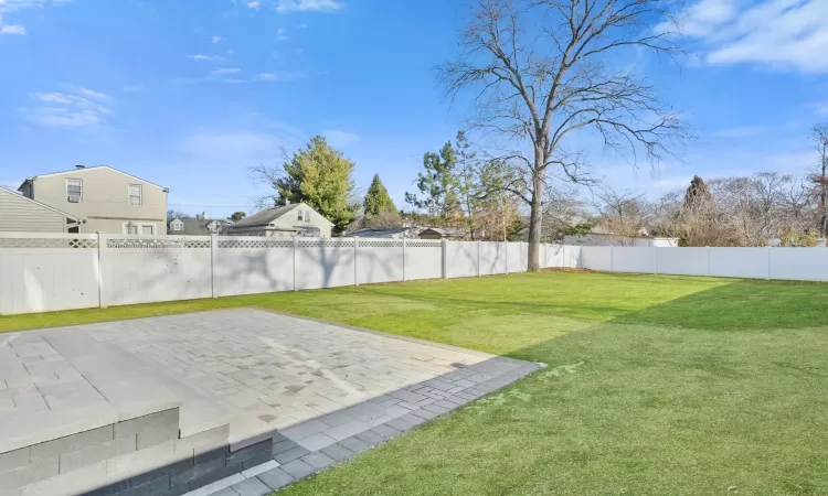 View of yard with a patio