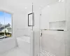 Bathroom with independent shower and bath and ornamental molding