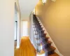 Staircase featuring hardwood / wood-style floors