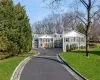 Greek revival house featuring a front lawn