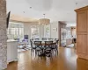 Dining room with light hardwood / wood-style flooring