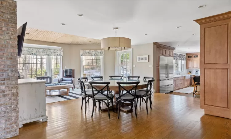 Dining room with light hardwood / wood-style flooring