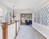 Hall with crown molding and hardwood / wood-style floors