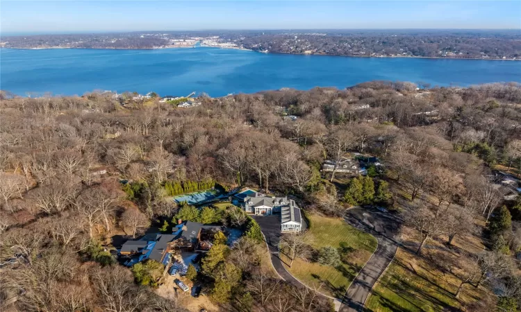 Birds eye view of property featuring a water view