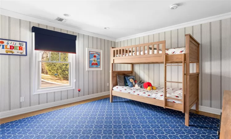 Bedroom featuring crown molding