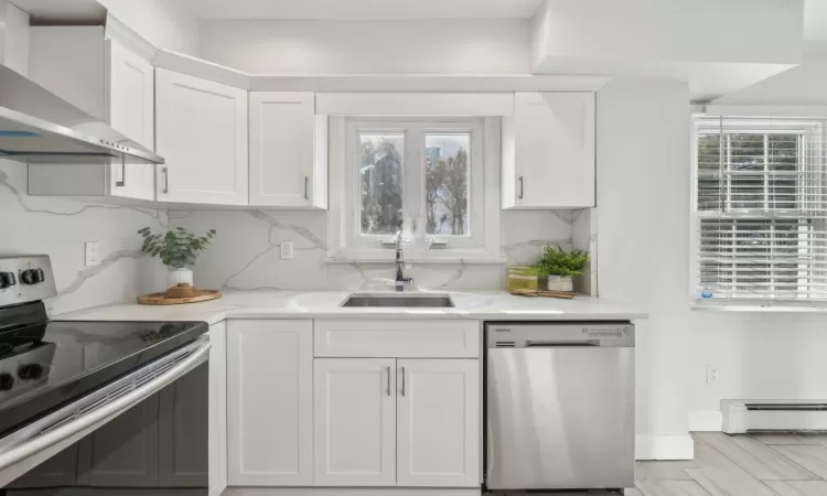 Updated kitchen with quartz countertops and stainless-steel appliances