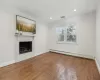 Family room with hardwood floors and fireplace