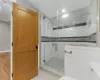 Bathroom with wood-type flooring and walk in shower