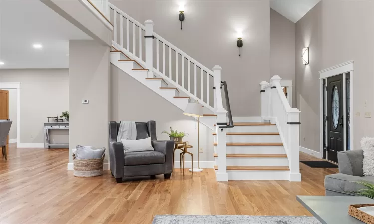 Stairway featuring hardwood / wood-style flooring